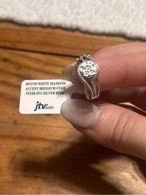 JTV Rhodium Over Sterling Silver Ring with White Diamond Accents